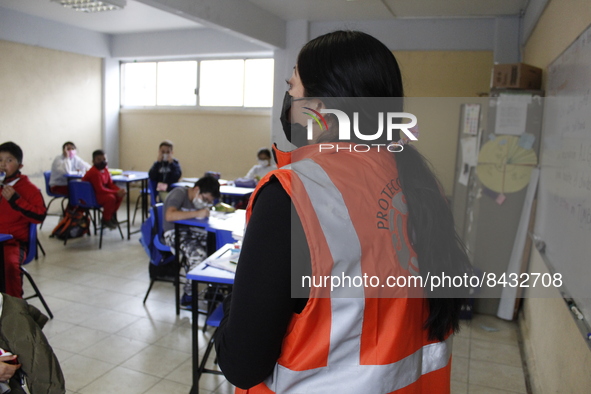 Civil Protection workers spread disinfectant inside class rooms of a primary school  to avoid new Covid-19 infections after an increase of C...