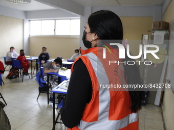 Civil Protection workers spread disinfectant inside class rooms of a primary school  to avoid new Covid-19 infections after an increase of C...