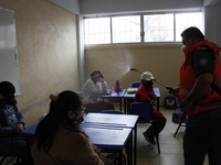 Civil Protection workers spread disinfectant inside class rooms of a primary school  to avoid new Covid-19 infections after an increase of C...