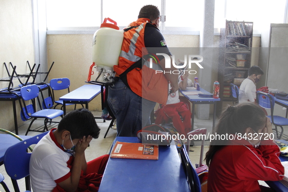 Civil Protection workers spread disinfectant inside class rooms of a primary school  to avoid new Covid-19 infections after an increase of C...