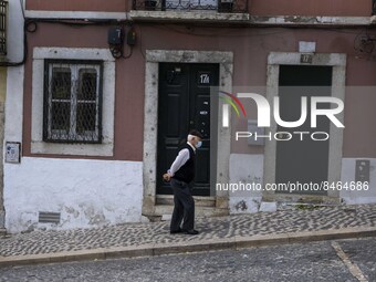 A man wearing a protective mask is seen walking down one of the streets of the Graça neighborhood. Lisbon, June 24, 2022. In Portugal, covid...