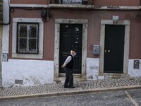 A man wearing a protective mask is seen walking down one of the streets of the Graça neighborhood. Lisbon, June 24, 2022. In Portugal, covid...