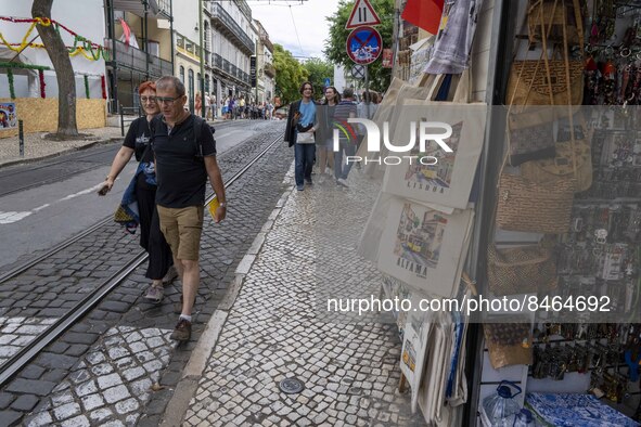 People are seen walking down one of the streets in the Graça neighborhood. Lisbon, June 24, 2022. In Portugal, covid-19 mortality is declini...