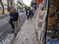 People are seen walking down one of the streets in the Graça neighborhood. Lisbon, June 24, 2022. In Portugal, covid-19 mortality is declini...