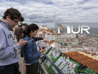 Tourists are seen observing the historic center of the city from the São Vicente viewpoint. Lisbon, June 24, 2022. In Portugal, covid-19 mor...