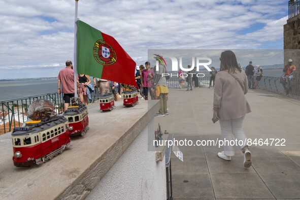 Tourists are seen observing the historic center of the city from Das Portas do Sol viewpoint. Lisbon, June 24, 2022. In Portugal, covid-19 m...