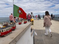 Tourists are seen observing the historic center of the city from Das Portas do Sol viewpoint. Lisbon, June 24, 2022. In Portugal, covid-19 m...