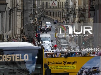 People are seen traveling through the streets of Baixa in a tourist transport bus. Lisbon, June 24, 2022. In Portugal, covid-19 mortality is...