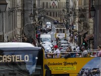 People are seen traveling through the streets of Baixa in a tourist transport bus. Lisbon, June 24, 2022. In Portugal, covid-19 mortality is...