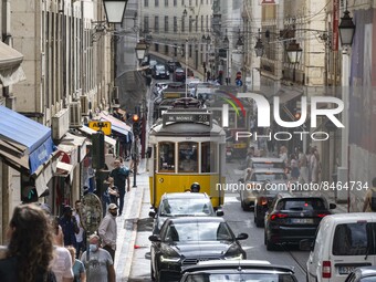 Vehicles and trams are seen driving through the streets of the Baxia district. Lisbon, June 24, 2022. In Portugal, covid-19 mortality is dec...