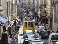 Vehicles and trams are seen driving through the streets of the Baxia district. Lisbon, June 24, 2022. In Portugal, covid-19 mortality is dec...