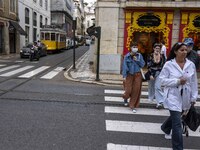 People are seen walking in the streets of the Baixa district. Lisbon, June 24, 2022. In Portugal, covid-19 mortality is declining, although...