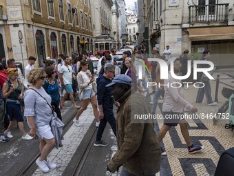 People are seen walking in the streets of the Baixa district. Lisbon, June 24, 2022. In Portugal, covid-19 mortality is declining, although...