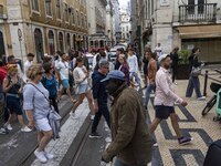 People are seen walking in the streets of the Baixa district. Lisbon, June 24, 2022. In Portugal, covid-19 mortality is declining, although...