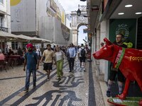 People are seen walking in the streets of the Baixa district. Lisbon, June 24, 2022. In Portugal, covid-19 mortality is declining, although...