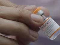 Medical personnel hold a Pfizer-BioNTech biological ampoule against COVID-19 to be applied to children under 11 years of age in Mexico City....