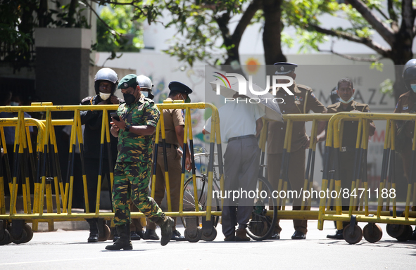 A man crosses the police Roadblock during a protest amid the country’s economic crisis in Colombo, Sri Lanka, on June 29, 2022.