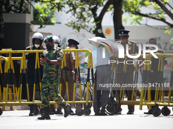 A man crosses the police Roadblock during a protest amid the country’s economic crisis in Colombo, Sri Lanka, on June 29, 2022.(