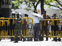 A man crosses the police Roadblock during a protest amid the country’s economic crisis in Colombo, Sri Lanka, on June 29, 2022.(