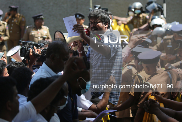 Sri Lankan health workers shout slogans in protest amid the country’s economic crisis in Colombo, Sri Lanka, June 29, 2022.