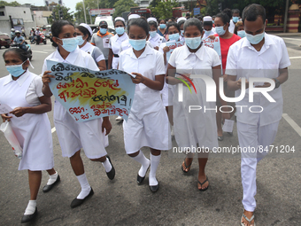 Sri Lankan health workers shout slogans in protest amid the country’s economic crisis in Colombo, Sri Lanka, June 29, 2022.(