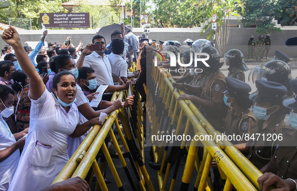 Sri Lankan health workers shout slogans in protest amid the country’s economic crisis in Colombo, Sri Lanka, June 29, 2022.