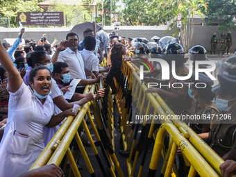 Sri Lankan health workers shout slogans in protest amid the country’s economic crisis in Colombo, Sri Lanka, June 29, 2022.(