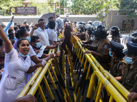 Sri Lankan health workers shout slogans in protest amid the country’s economic crisis in Colombo, Sri Lanka, June 29, 2022.(