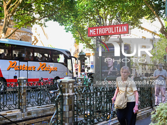 A woman about to enter the metro station. Daily life in Parisian metro, as France faces an increase of Covid19 cases. . (