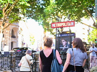 Women pass by the metro station. Daily life in Parisian metro, as France faces an increase of Covid19 cases. . (