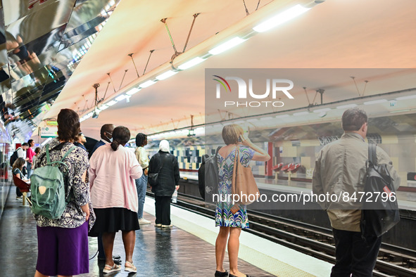 People waiting for the metro on the platform. Daily life in Parisian metro, as France faces an increase of Covid19 cases. . 