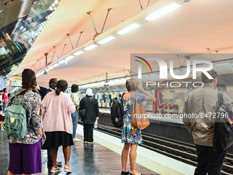 People waiting for the metro on the platform. Daily life in Parisian metro, as France faces an increase of Covid19 cases. . (