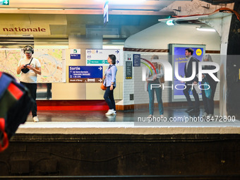 People waiting for the metro on the platform. Daily life in Parisian metro, as France faces an increase of Covid19 cases. . (