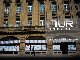 a man walks pass a coronavirus test center in Cologne, Germany on July 1, 2022 as most people Germany will have to pay for covid test from J...