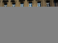 a man walks pass a coronavirus test center in Cologne, Germany on July 1, 2022 as most people Germany will have to pay for covid test from J...