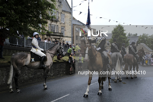 Galashiels, UK. 02 Jul.2022.  
Braw Lad John Turnbull carries the Burgh Flag on horse back , ready to lead the ceremonial rideout.

GALASHIE...