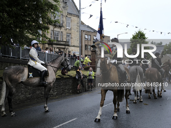 Galashiels, UK. 02 Jul.2022.  
Braw Lad John Turnbull carries the Burgh Flag on horse back , ready to lead the ceremonial rideout.

GALASHIE...