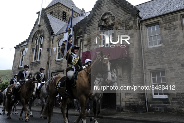 Galashiels, UK. 02 Jul.2022.  
Braw Lad John Turnbull carries the Burgh Flag on horse back , ready to lead the ceremonial rideout.

GALASHIE...