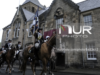 Galashiels, UK. 02 Jul.2022.  
Braw Lad John Turnbull carries the Burgh Flag on horse back , ready to lead the ceremonial rideout.

GALASHIE...