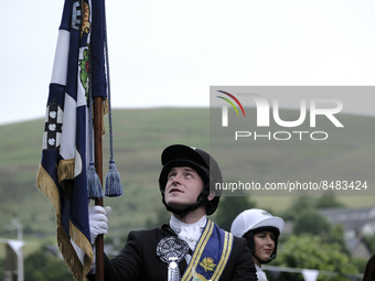 Galashiels, UK. 02 Jul.2022.  
Braw Lad John Turnbull carries the Burgh Flag on horse back , ready to lead the ceremonial rideout.

GALASHIE...