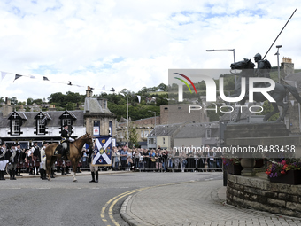 Galashiels, UK. 02 Jul.2022.  
Braw Lad arrives at War Memorial behind Pipe Band.
before the dipping of the Burgh Flag in front of the War M...