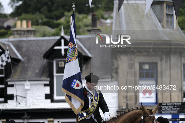 Galashiels, UK. 02 Jul.2022.  
Braw Lad arrives at War Memorial behind Pipe Band.
before the dipping of the Burgh Flag in front of the War M...