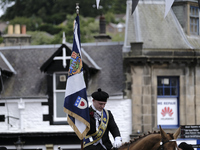 Galashiels, UK. 02 Jul.2022.  
Braw Lad arrives at War Memorial behind Pipe Band.
before the dipping of the Burgh Flag in front of the War M...