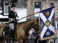 Galashiels, UK. 02 Jul.2022.  
Braw Lad arrives at War Memorial behind Pipe Band.
before the dipping of the Burgh Flag in front of the War M...