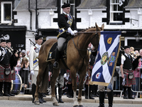 Galashiels, UK. 02 Jul.2022.  
Braw Lad arrives at War Memorial behind Pipe Band.
before the dipping of the Burgh Flag in front of the War M...