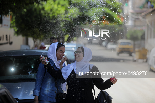 Palestinian students celebrate the last day in their final high school exams, known as ''Tawjihi'', in Gaza city on July 04, 2022.  