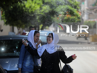 Palestinian students celebrate the last day in their final high school exams, known as ''Tawjihi'', in Gaza city on July 04, 2022.  (