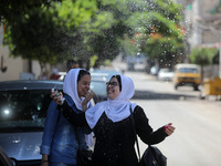 Palestinian students celebrate the last day in their final high school exams, known as ''Tawjihi'', in Gaza city on July 04, 2022.  (