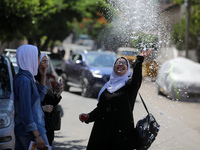 Palestinian students celebrate the last day in their final high school exams, known as ''Tawjihi'', in Gaza city on July 04, 2022.  (