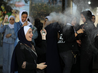 Palestinian students celebrate the last day in their final high school exams, known as ''Tawjihi'', in Gaza city on July 04, 2022.  (